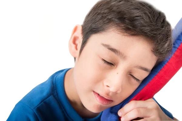 Niño durmiendo en la cama sobre fondo blanco — Foto de Stock