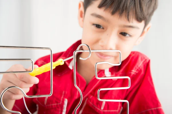 Little boy playing coil spark with concentrate close up — Stock Photo, Image