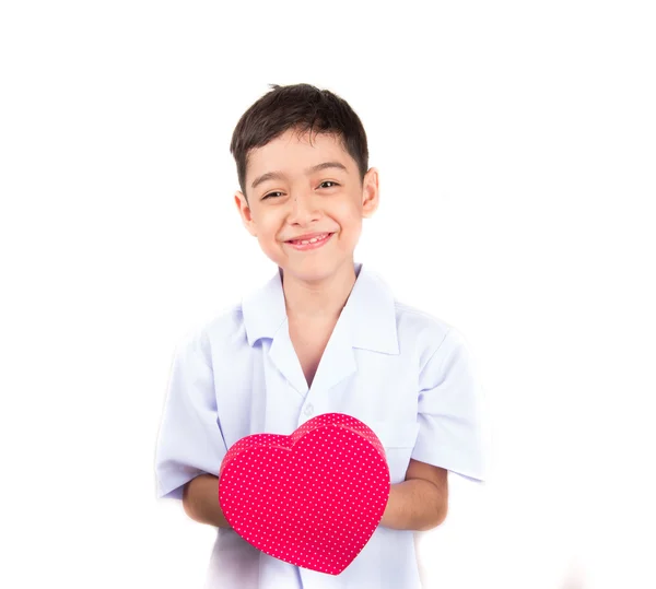 Liten pojke med hjärta form pretent som läkare på vit bakgrund — Stockfoto