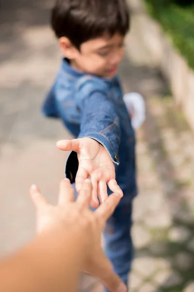 Little boy holding hand mother walking together mother's eye view — Stock Photo, Image