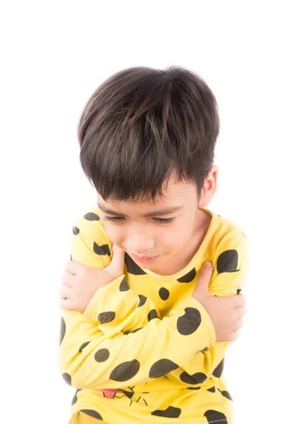 Little boy hugging himself wearing pajamas — Stock Photo, Image