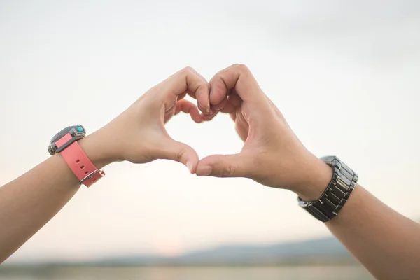 Lovers hand making heart shape — Stock Photo, Image