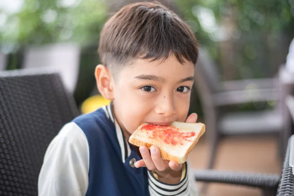 Little boy having breakfast — Stock Photo, Image