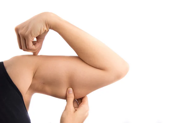 Brazo de mujer mostrando músculo — Foto de Stock