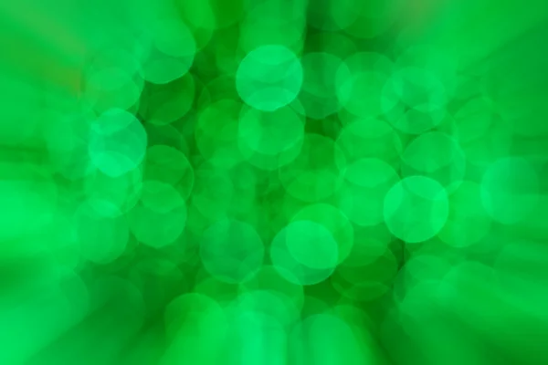 Green bokeh of Christmas light with zoomed in effect border — Stock Photo, Image