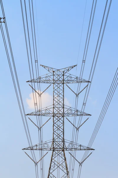 High tension electrical pole against blue sky — Stock Photo, Image