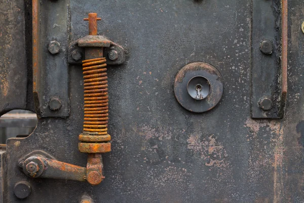 Roestige voorjaar op oude machine — Stockfoto