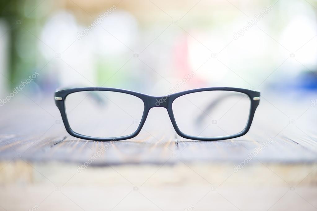 Old eye glasses on bokeh background 