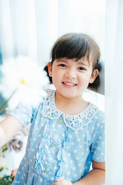 Portrait Cute Little Girl Blue Dress Holding White Flower Curtain — Stock Photo, Image