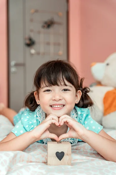 Little Girl Making Sign Heart Gesture Fingers Bedroom — Stock Photo, Image