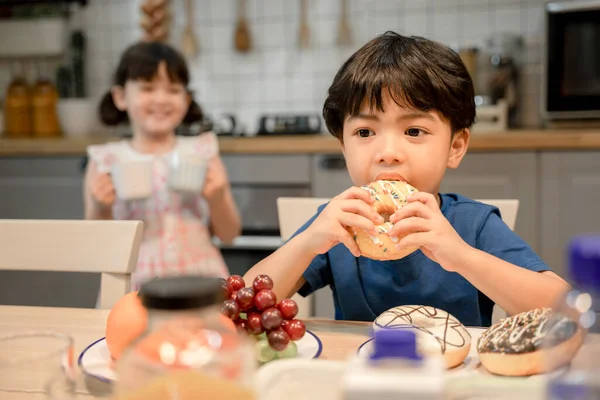 Little Boy Enjoy Eating Sweet Donut Kitchen Big Sister — Stock Photo, Image
