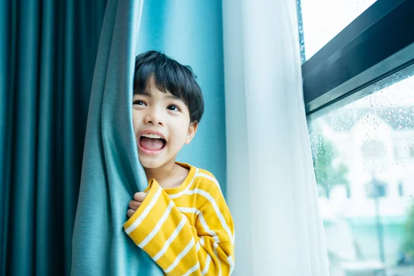 Portrait Cheerful Funny Boy White Sweater Blue Curtain Window — Stock Photo, Image