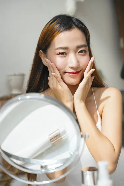 Young Asian Woman Applying Cream Lotion Her Face Natural Light — Stock Photo, Image