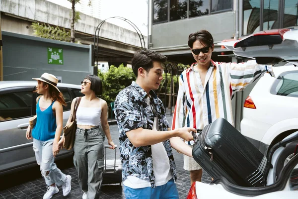 Young asian tourist people preparing for road trip in the weekend.