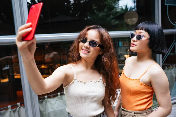Portrait Two Young Asian Women Wear Sunglasses Taking Selfie Smartphone — Stock Photo, Image