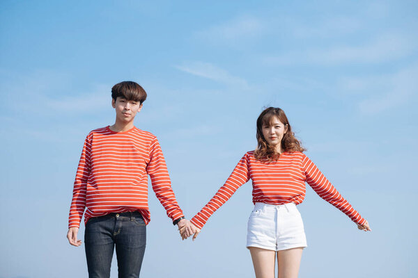 Teenage Couple Stand Hold Each Other Hand Blue Sky Background Stock Photo