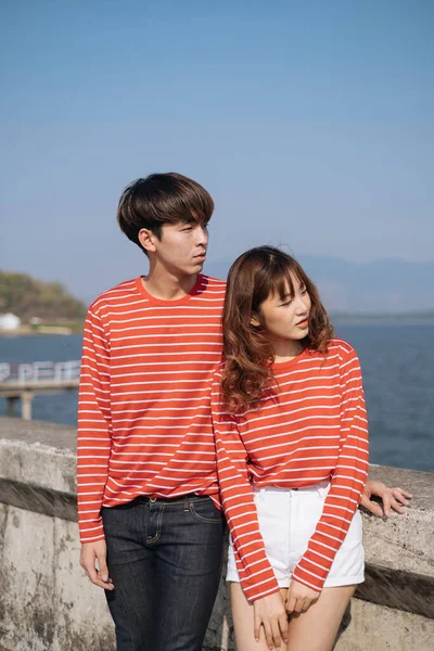 Couple Red Matching Shirt Stand Dam Look Sea Stock Image