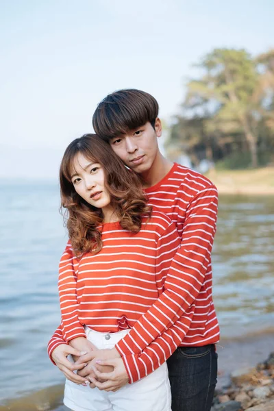 Curly Long Hair Woman Standing Front Her Boyfriend While Hug Stock Image