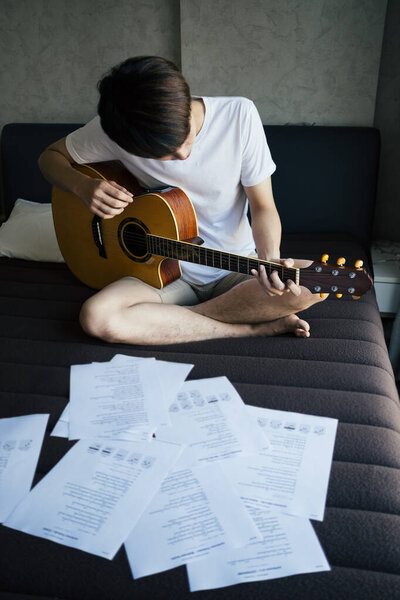 Young Thai Guitarist Man Practicing Acoustic Guitar Bedroom Reading Music Stock Image