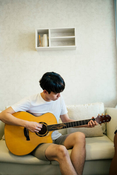 Young Thai Guitarist Man Playing Acoustic Guitar Couch Living Room Royalty Free Stock Images