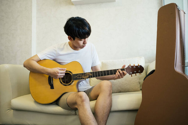 Young Thai Guitarist Man Playing Acoustic Guitar Couch Living Room Stock Photo