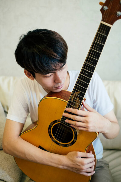 Young Thai Guitarist Man Playing Acoustic Guitar Couch Home Royalty Free Stock Photos