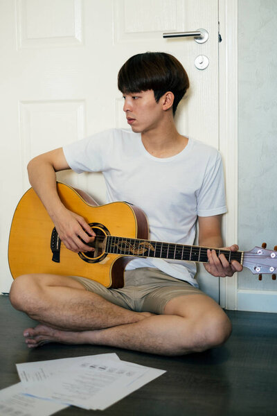 Young Thai Guitarist Man Sitting Floor Practicing Acoustic Guitar House Royalty Free Stock Photos