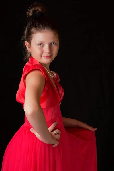 Portrait of a girl in a dress on black background — Stock Photo, Image