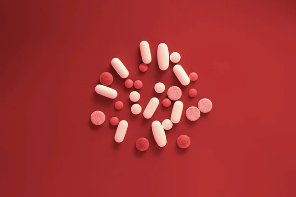 Medicine white and red pills on a bloody red background