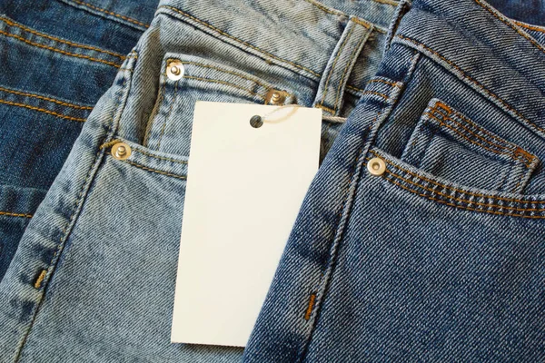 Wit Label Voor Modelleren Een Jeans Kledij Achtergrond Winkelen Verkoop — Stockfoto