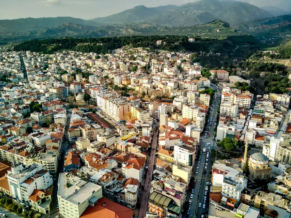 Aerial photograph of the capital of Aydin province - Aydin city from high point of drone fly in sunny day in Turkey. Amazing aerial cityscape view from birds fly altitude on beautiful city centre and parks.