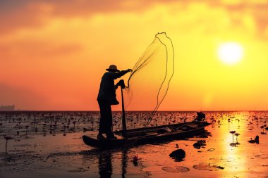 Fisherman in action when fishing clipart