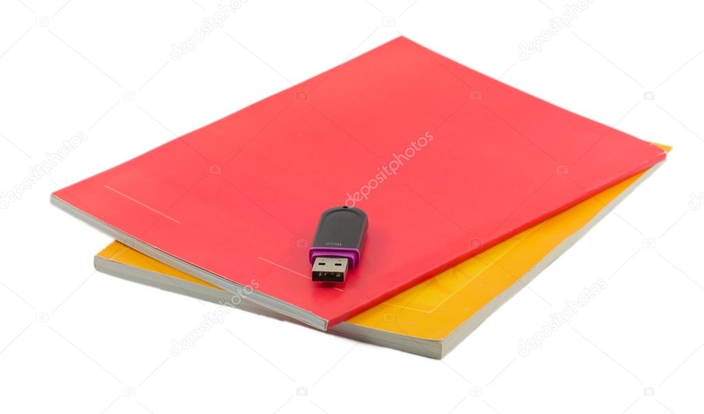 two notebooks and flash drive isolated on white background
