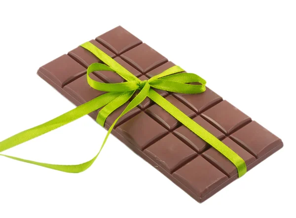 Bar of chocolate and green ribbon isolated on white background — Stock Photo, Image