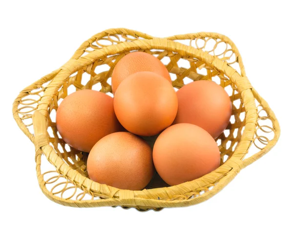 Eggs in a basket isolated on a white background — Stock Photo, Image