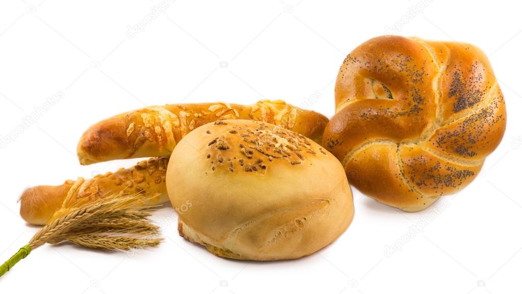 Bread with a bunch of wheat ears isolated on white background