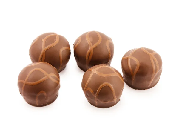 Vijf chocolade snoepjes geïsoleerd op een witte achtergrond Rechtenvrije Stockfoto's