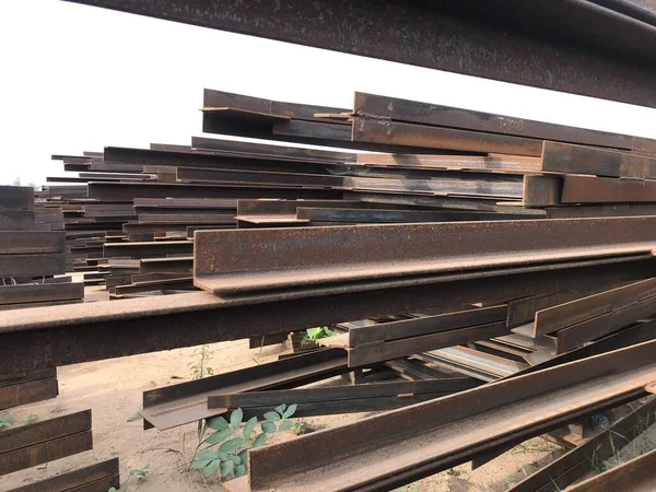 structural steel beam and angles stored at an fabrication yard for an project fabrication works