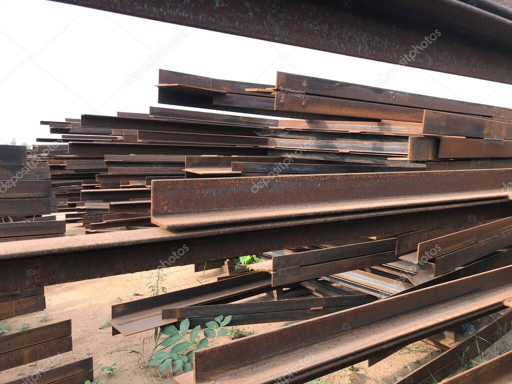 structural steel beam and angles stored at an fabrication yard for an project fabrication works
