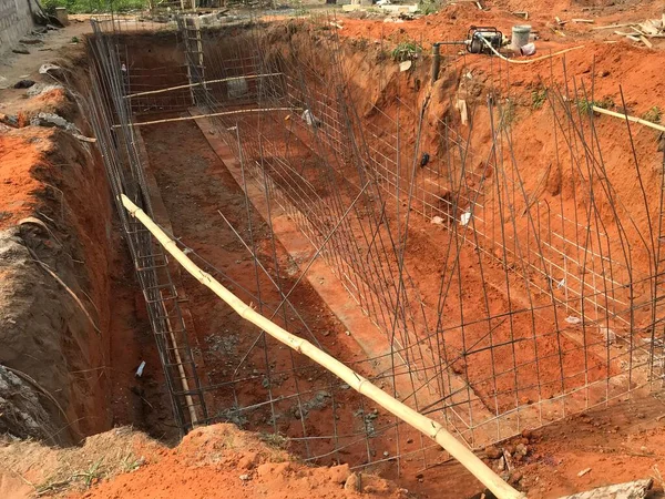 Construction works like excavation footing with reinforcement works are ongoing for an Project