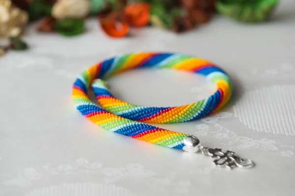 Crochet necklace made from seed beads rainbow colors — Stock Photo, Image