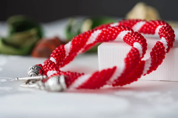 Handmade beaded necklace from beads of red and white color