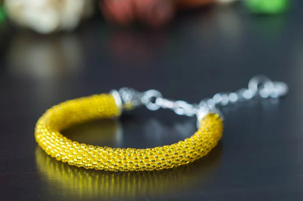 Crochet beaded bracelet from beads of yellow color