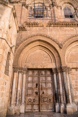The door of the temple of the Holy Sepulcher Israel, Jerusalem. Wooden antique door with iron bars, closed due to quarantine during the coronavirus pandemic
