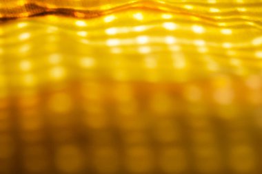 Işıkla dolu tam bokeh bulanık arkaplan. Sarı aksanlı bulanık arkaplan.