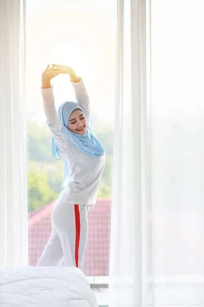 Beautiful Asian Muslim Woman Wearing White Sleepwear Stretching Her Arms — Stock Photo, Image