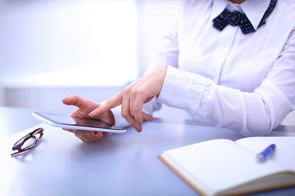 Woman in office using mobile phone