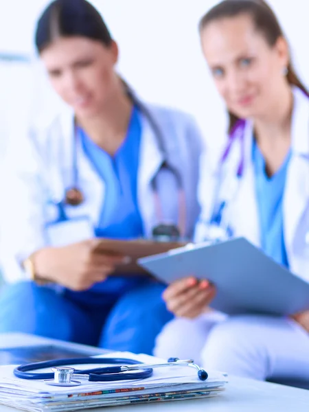 Two young women doctors sitting on the sofa — Stock Photo, Image