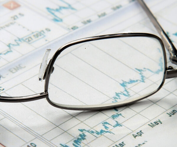 Eyeglasses lying down on a business document