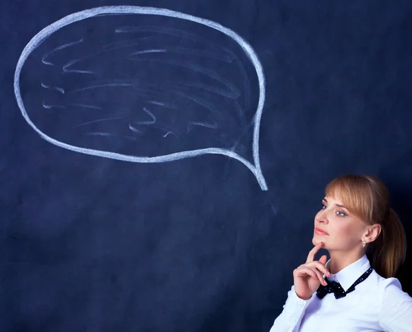 Smiling thinking girl looking with empty bubble — Stock Photo, Image